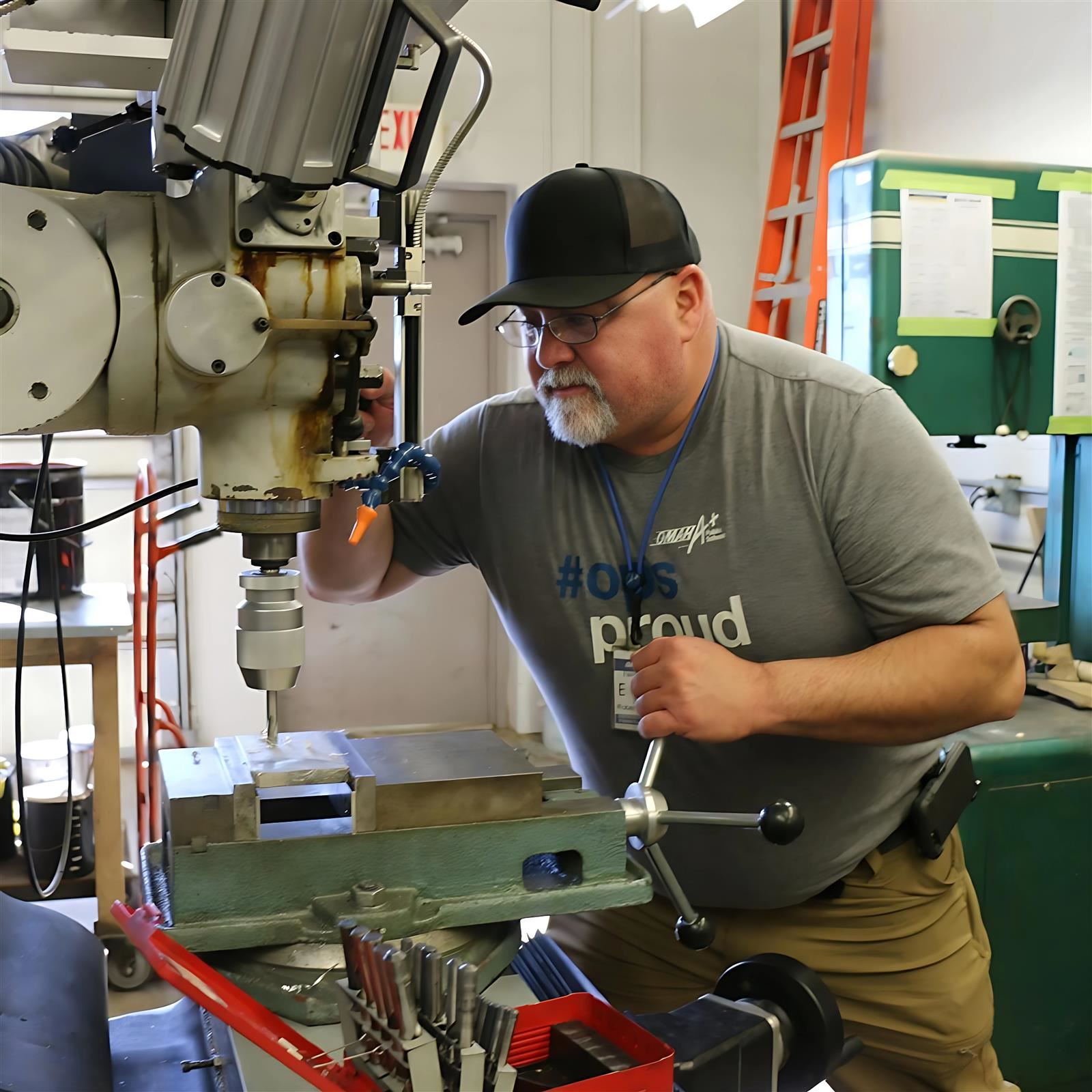  Dan Eggen works with a drill press